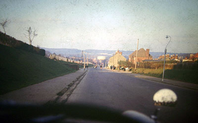 A view taken in the 1960s looking down   Greys Road   towards Henley town centre. Note: The prominent gas tower.    Photo kindly provided by Roy Sadler.  