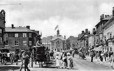 A bustling Henley town centre looking towards the   Henley Town Hall   during what appears to be the height of Henley Regatta week.