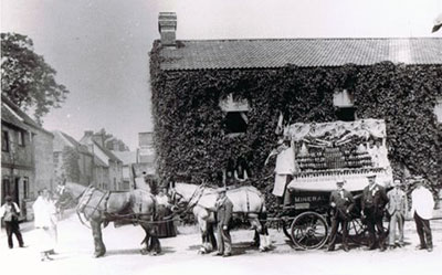 A fully loaded cart and horses outside Henley Brewery.    Photo kindly provided by Mick Martin.  